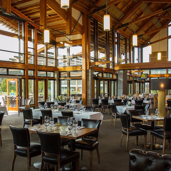 Summit Lodge dining room with floor-to-ceiling windows and heavy timber beams