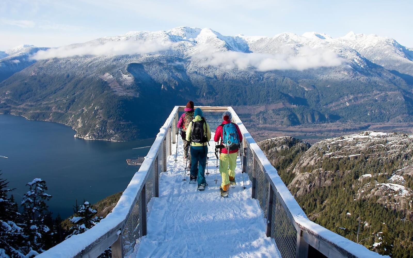 Visitors on the summit viewing platform above Howe Sound in winter